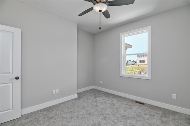 carpeted empty room with ceiling fan