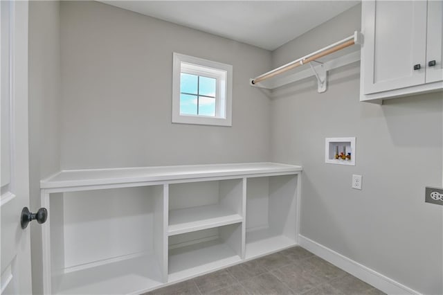 laundry room featuring hookup for a washing machine, cabinets, and hookup for an electric dryer