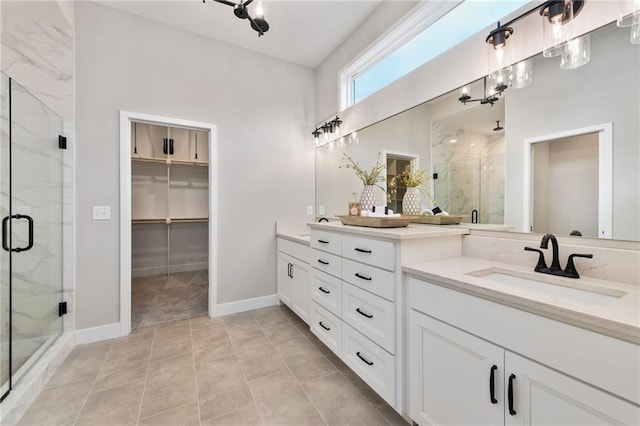 bathroom with vanity, tile patterned flooring, and a shower with door