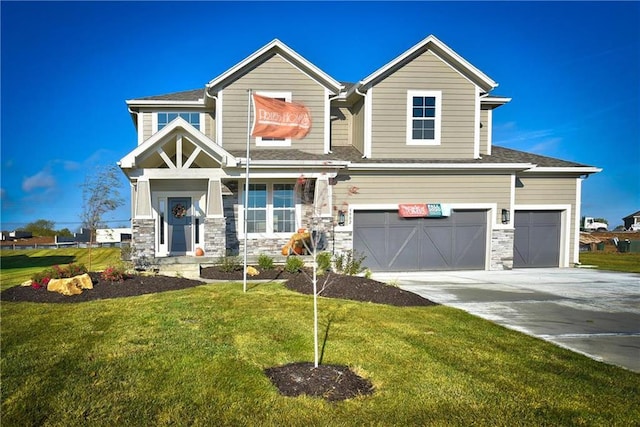 craftsman inspired home with a front yard and a garage