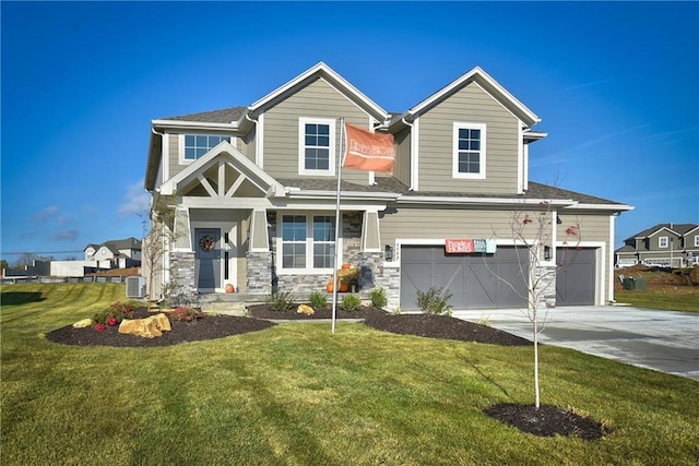 view of front of home featuring cooling unit, a front yard, and a garage