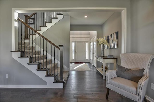 foyer entrance featuring dark hardwood / wood-style floors