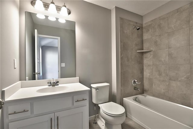 full bathroom featuring toilet, vanity, and tiled shower / bath