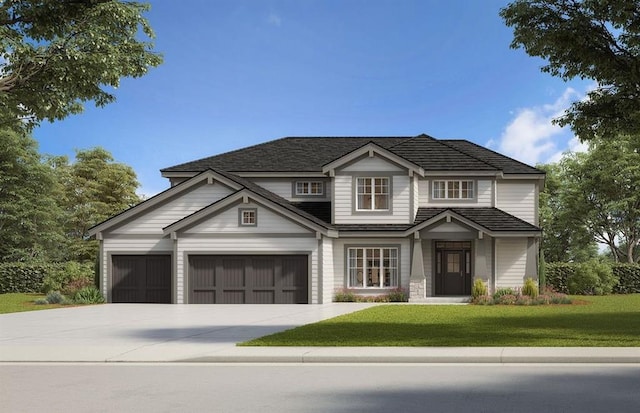 view of front of house featuring a garage and a front lawn