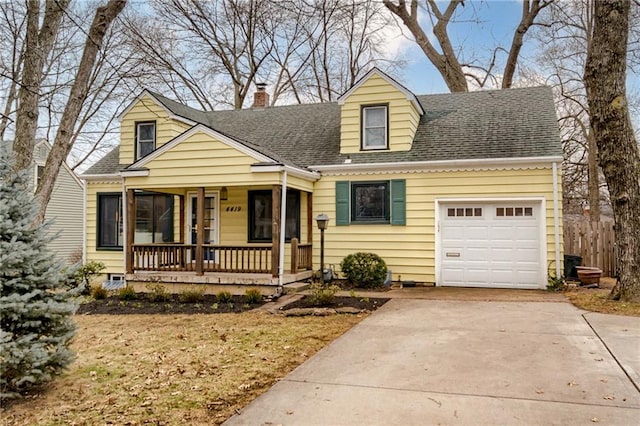 cape cod-style house featuring a garage and covered porch