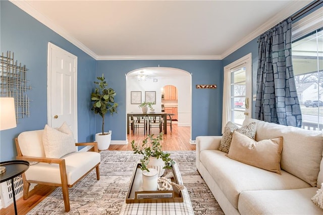 sitting room featuring crown molding and hardwood / wood-style floors