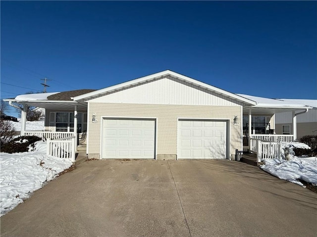 view of front facade with a garage and covered porch