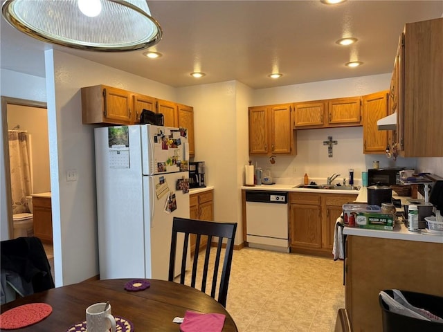 kitchen with sink and white appliances