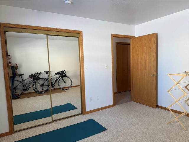 carpeted bedroom featuring a closet