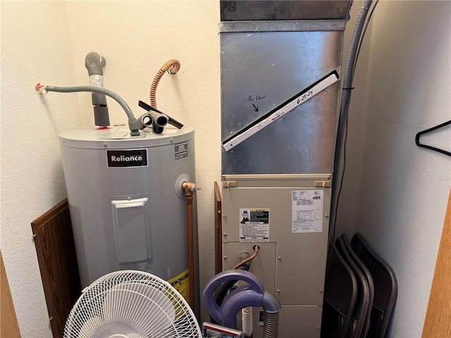 utility room with water heater