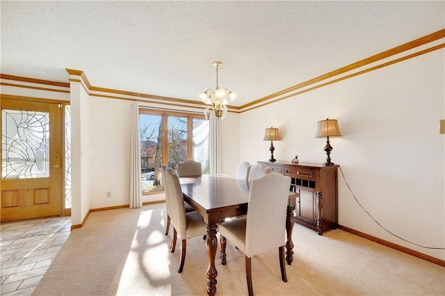 dining space with light colored carpet, ornamental molding, a textured ceiling, a chandelier, and baseboards