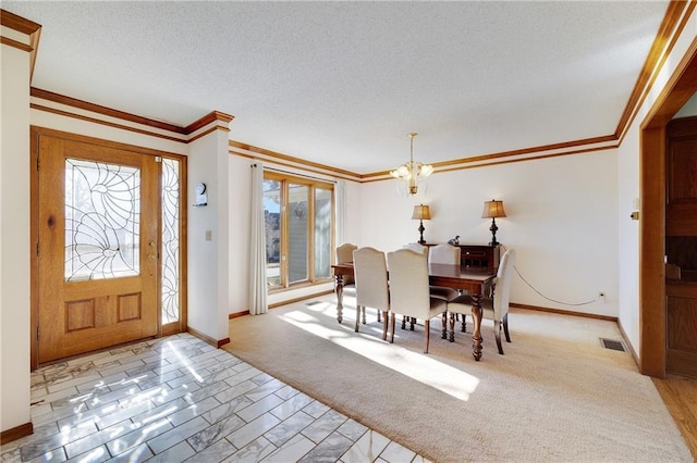 carpeted dining space with crown molding, visible vents, and a notable chandelier