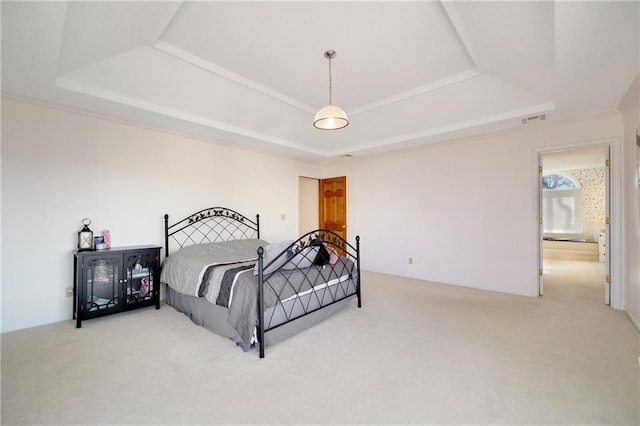 carpeted bedroom with a tray ceiling and visible vents