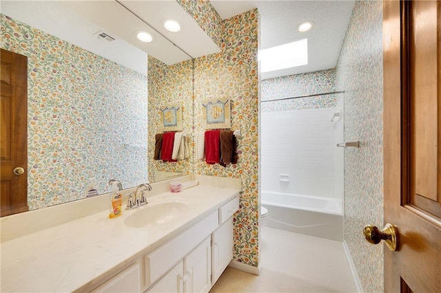 bathroom featuring toilet, wallpapered walls, visible vents, and vanity