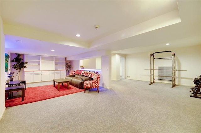 interior space featuring visible vents, baseboards, carpet, a tray ceiling, and recessed lighting