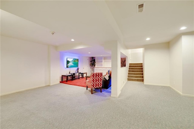 living area featuring carpet floors, recessed lighting, visible vents, and stairway