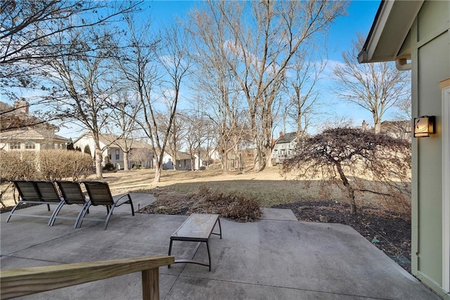 exterior space featuring a patio area and a residential view