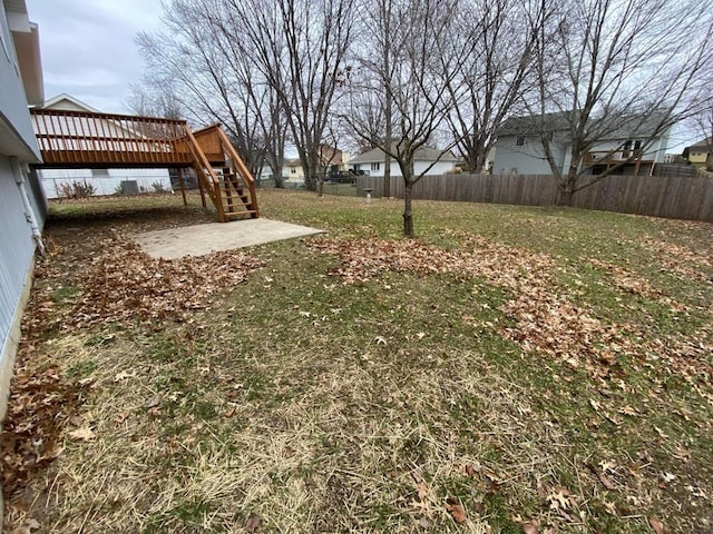 view of yard with a patio area and a wooden deck