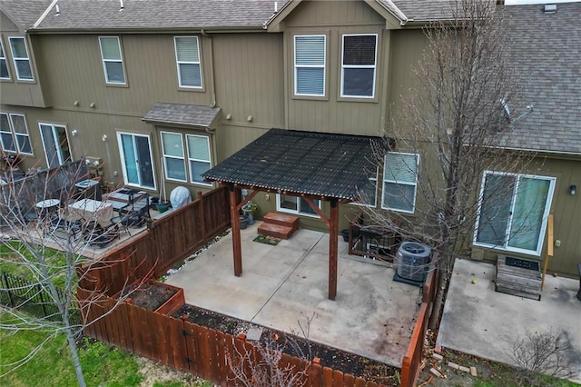 back of house with a patio area and central AC unit