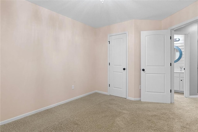 unfurnished bedroom with carpet floors