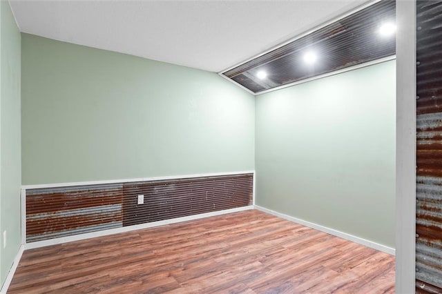 empty room with hardwood / wood-style floors