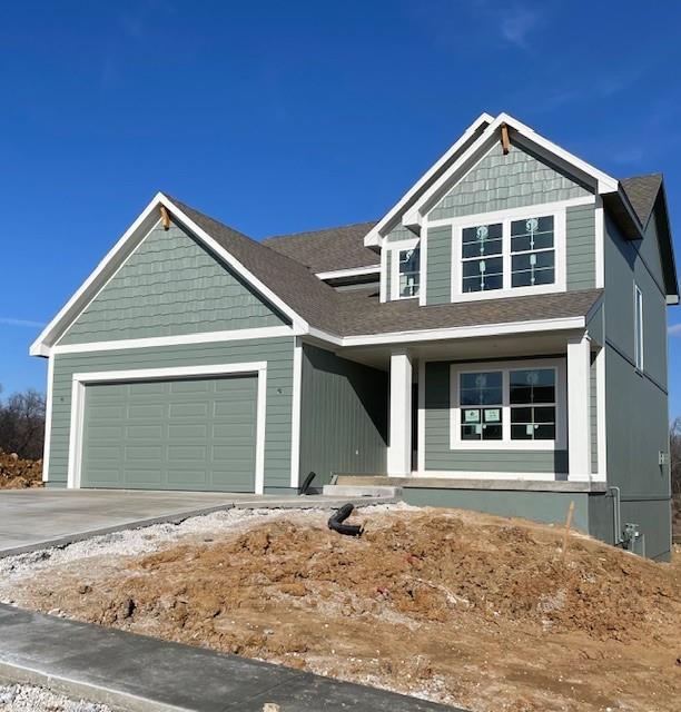 craftsman house with a garage