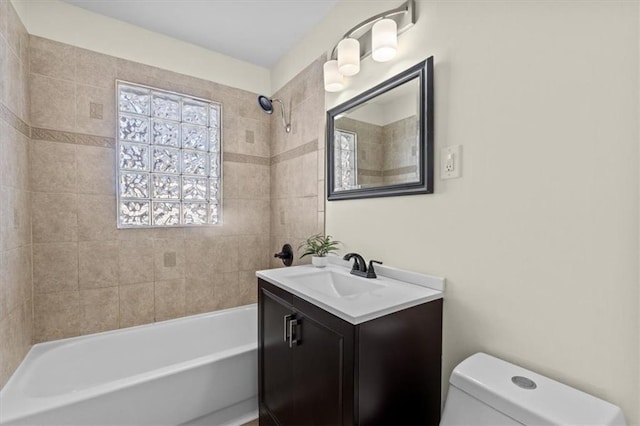 full bath featuring shower / washtub combination, vanity, and toilet