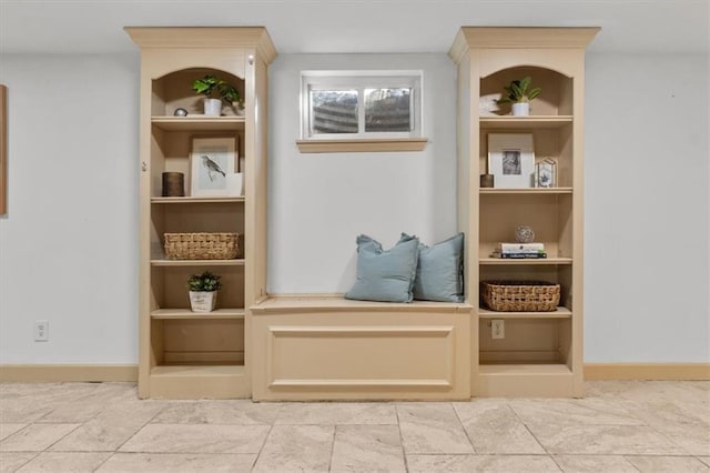 mudroom featuring built in features and baseboards