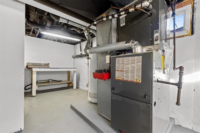 utility room with heating unit