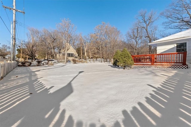 view of yard featuring a wooden deck and fence