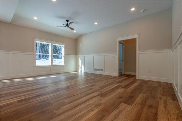 spare room featuring wood-type flooring and ceiling fan