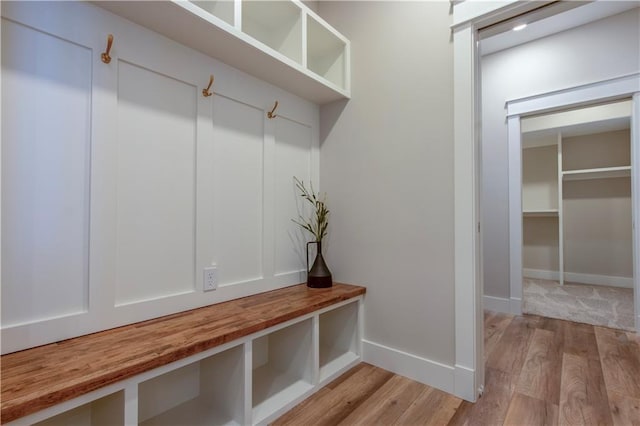 mudroom with light hardwood / wood-style floors