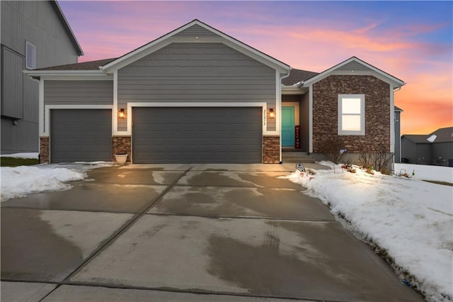 view of front of home with a garage and concrete driveway