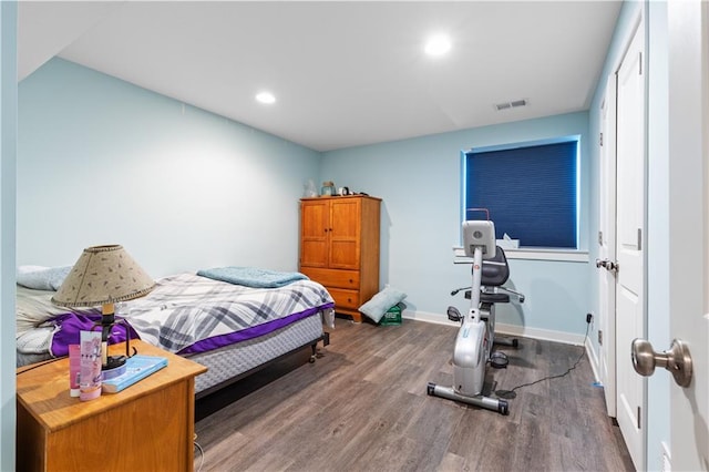 25215 W 141st Ter, Olathe, KS 66061 - bedroom featuring wood finished floors, baseboards, and recessed lighting