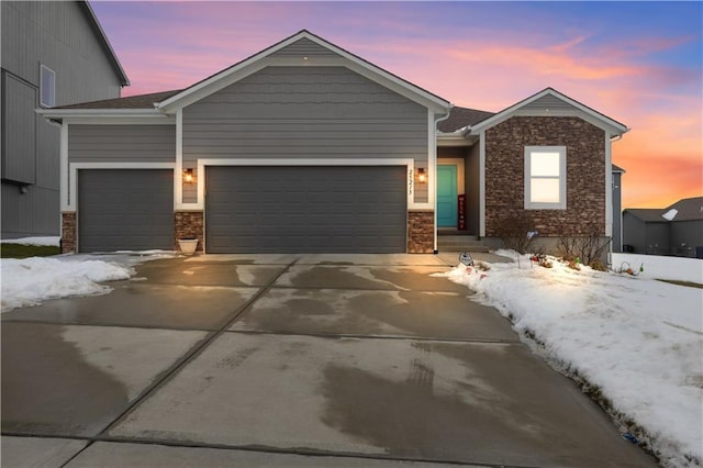 25215 W 141st Ter, Olathe, KS 66061 - ranch-style house with an attached garage, concrete driveway, and brick siding