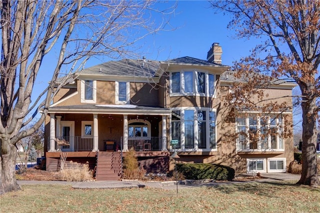 view of front of house featuring a porch and a front yard