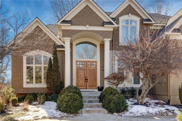 view of snow covered property entrance