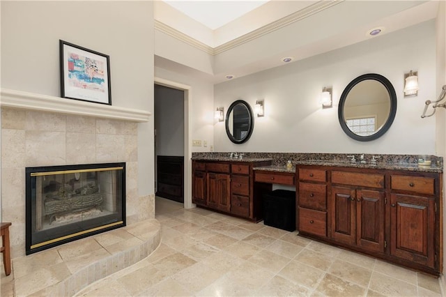 bathroom with vanity and a fireplace