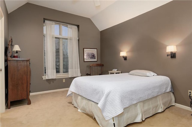 bedroom featuring light colored carpet and vaulted ceiling