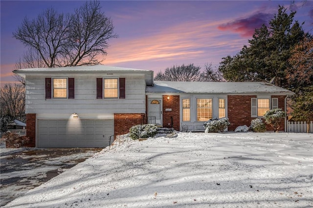 split level home featuring a garage