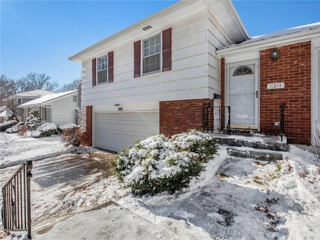 split level home with a garage