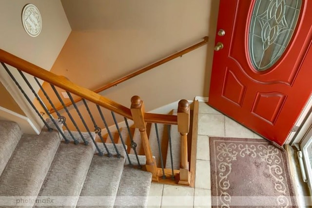 stairs featuring tile patterned floors