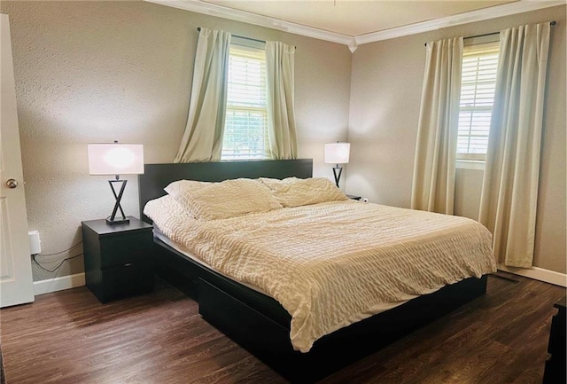 bedroom with ornamental molding and dark wood-type flooring