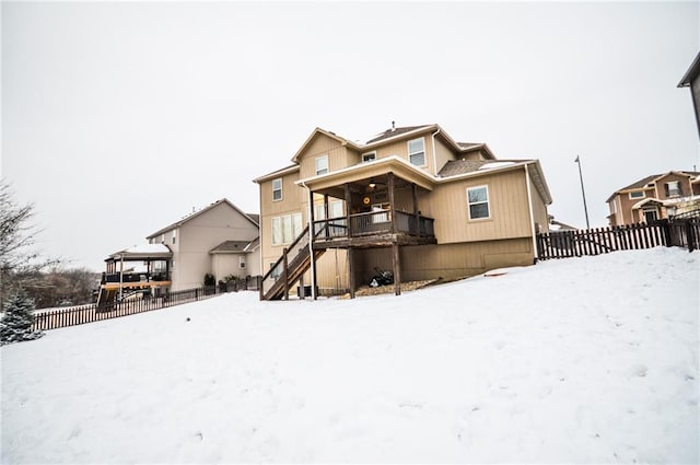 view of snow covered house