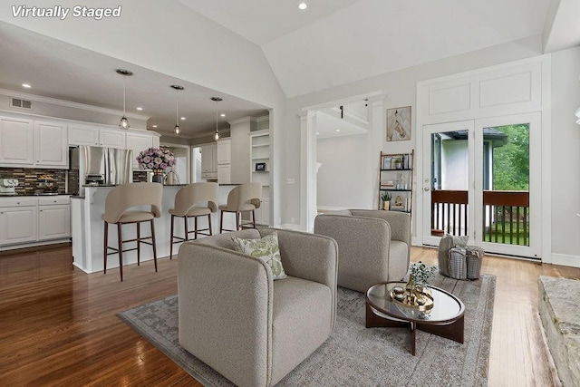 12823 Connell St, Overland Park, KS 66213 - living area featuring dark wood-style flooring, recessed lighting, and high vaulted ceiling