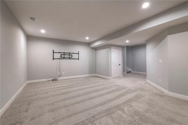 basement with light colored carpet