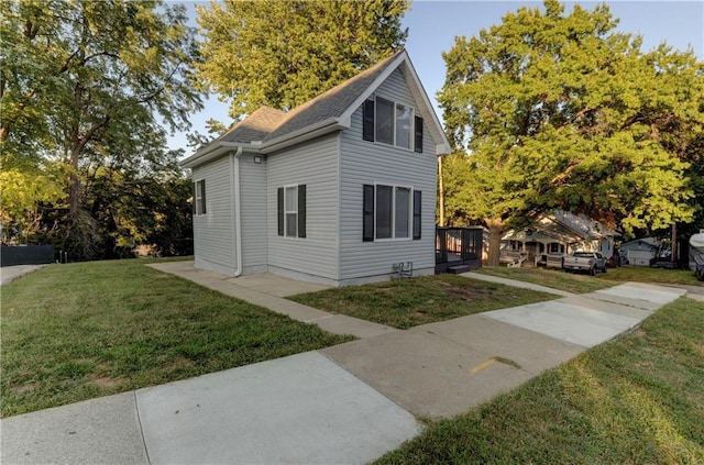 view of home's exterior with a yard