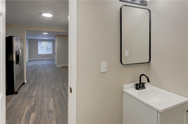 bathroom featuring hardwood / wood-style floors and vanity