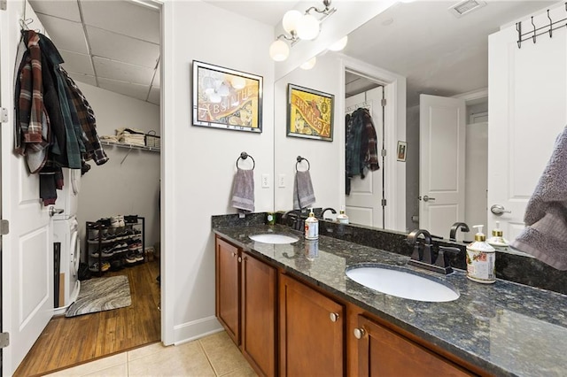 bathroom featuring tile patterned flooring and vanity