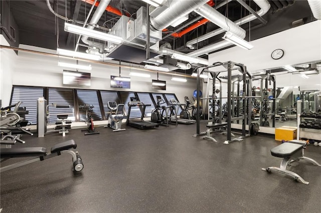 workout area with a high ceiling